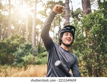 Mountain bike man celebrate achievement, success and goal in forest, woods or Norway park cycling race competition winner. Happy, excited and pride bicycle athlete freedom, energy and fist motivation - Powered by Shutterstock