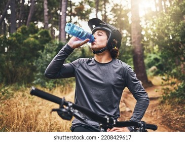 Mountain Bike Man Drinking Water Bottle In Forest, Woods And Mountains In Healthy Training, Cycling Freedom And Sports Challenge In Norway. Tired Bicycle Athlete Relax For Energy In Adventure Workout