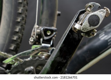 Mountain bike in the workshop. Pedal and front derailleur close-up. An active lifestyle using a serviceable bicycle