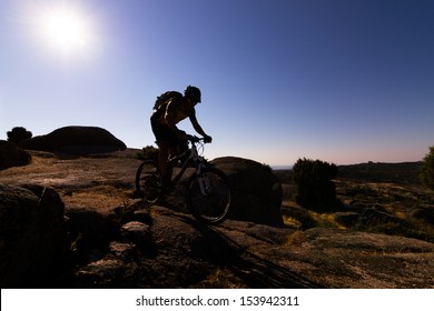 Mountain Biker Silhouette In Sunrise