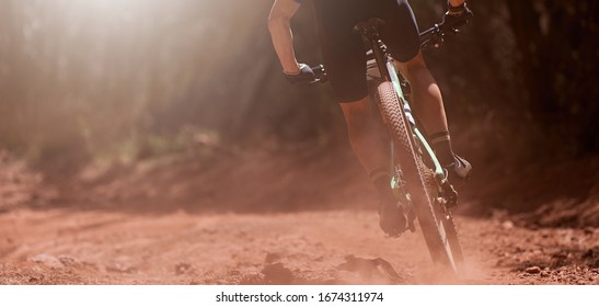 Mountain bikers riding on bike singletrack trail, mountain bike race - Shutterstock ID 1674311974
