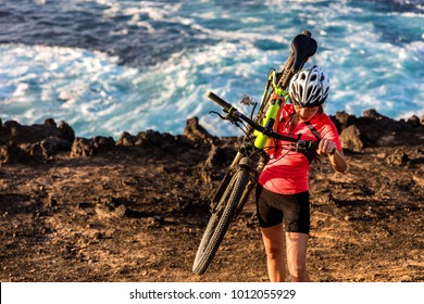 Mountain Biking Carrying Bike Uphill Walking Up Hill. MTB Biker Cyclist Riding Outdoors. Cycling Sports.