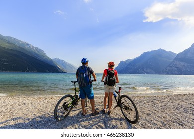 Mountain Biking, Couple With Bikes On Lake Garda, Riva Del Garda, Italy