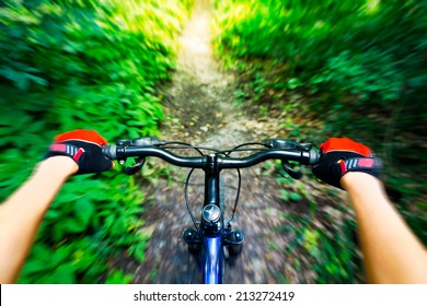 Mountain Biking Down Hill. View From Biker.