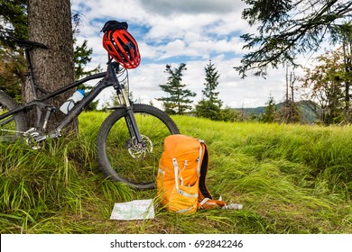 Mountain Biking Equipment In The Woods, Bikepacking Adventure Trip In Green Mountains. Travel Campsite And MTB Cycling With Backpack, Wilderness Forest In Poland.