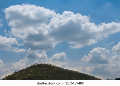 Mountain and blue cloudy sky