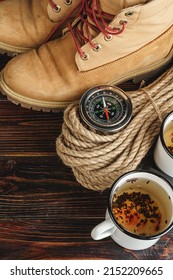 Mountain Boots And Hiking Gear On Wooden Planks