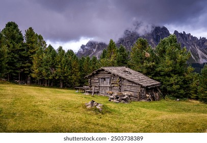 Mountain cabin in Alps. Mountain hut. A hut in the mountain Alps. Alpine mountain cabin - Powered by Shutterstock