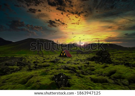 Mountain cabin with a sunset in Iceland
