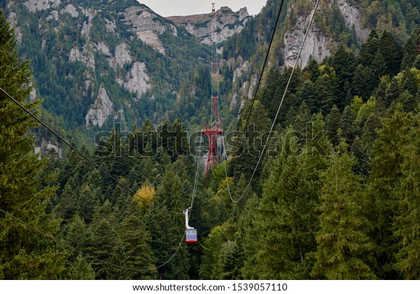 Mountain cable\
car, telecabin in the Bucegi Mountains. Mountain landscape in\
Bucegi Natural Park near Busteni,\
Romania.