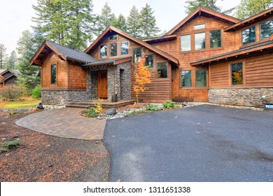 Mountain Cedar Home With Lots Of Windows And Rainy Weather