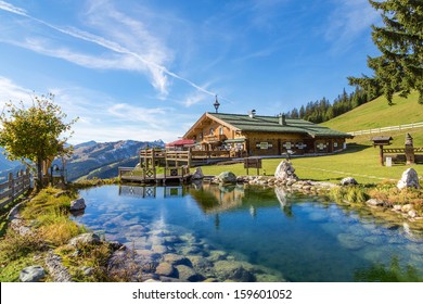 Mountain chalet with swimming pond - Powered by Shutterstock