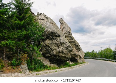 Mountain Cliffs At A Sharp Road Turn In The Mountains