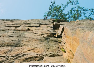 Mountain Climbing Wall. Training Area For Outdoor Activities. No People. Blue Sky.