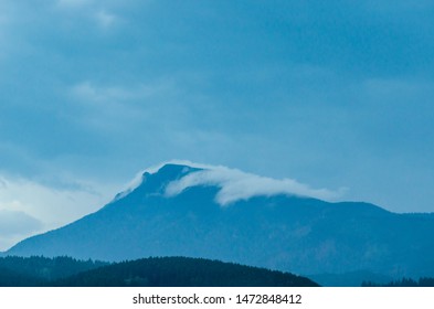 mountain with cloud on peak