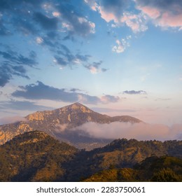 mountain in clouds at the evening