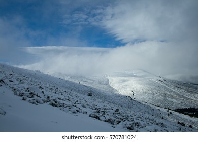Mountain with clouds and snow. 