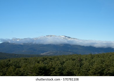 Mountain with clouds and snow. 
