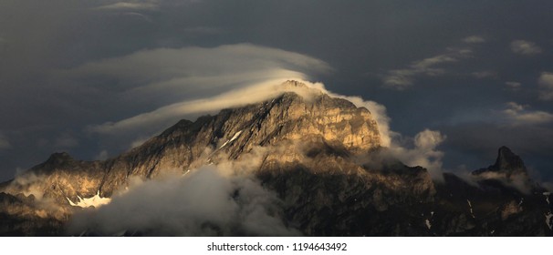 mountain and clouds in sunset light