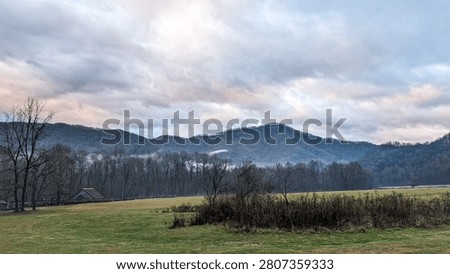 A mountain covered in clouds and trees at Oconaluftee visitor center in North Carolina USA
