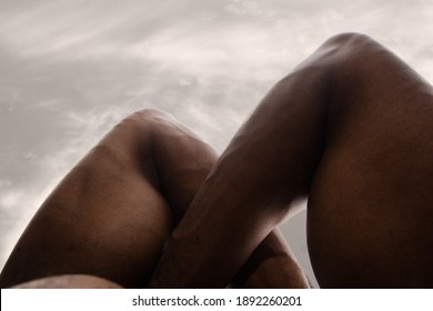 Mountain. Detailed Texture Of Human Skin. Close Up Of Young African-american Male Body Surface Like Landscape With The Sky On Background. Skincare, Bodycare, Healthcare, Inspiration, Fantasy Artwork.