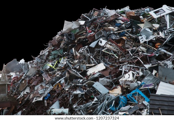 Mountain of\
discarded trash on a black\
background