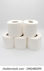 Mountain Of Five Toilet Paper Rolls With White Background.