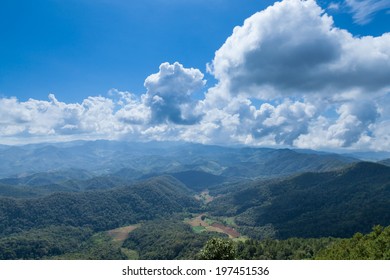 Mountain, forest and sky Forest covered mountain range is linear. Sky Cloud Cover