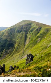 Mountain in the form of a triangle. The cone-shaped mountain.