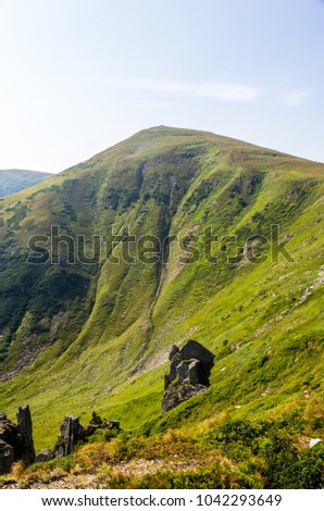 Mountain in the form of a triangle. The cone-shaped mountain.