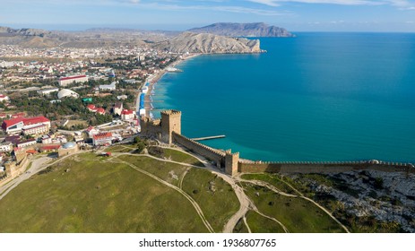 Mountain fortress (Genoese Fortress). Genoese Fortress is located in Sudak, Coast of the Crimea peninsula, rocky mountains, aerial view of the sea resort Sudak