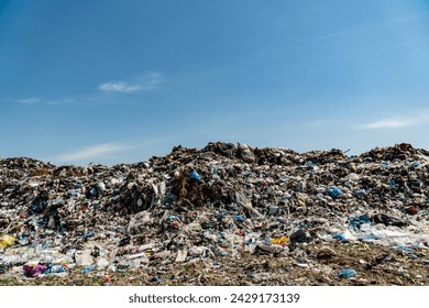 A mountain of garbage at a landfill. Household waste landfill. Problems with waste processing. - Powered by Shutterstock