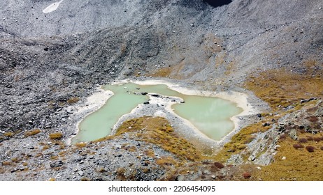 Mountain Glacier Lake. Picturesque Hidden Location In The Mountains. Outdoors Style Vacation. Adventure Travel In The Wildlife, No People. Mountain Valley Landscape Aerial View Stock Photo