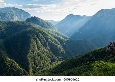 Mountain green range in clouds landscape.

