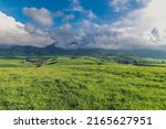 Mountain green valley and cloudy sky.Pasture in mountain valley.Mountain landscape.Natural background.