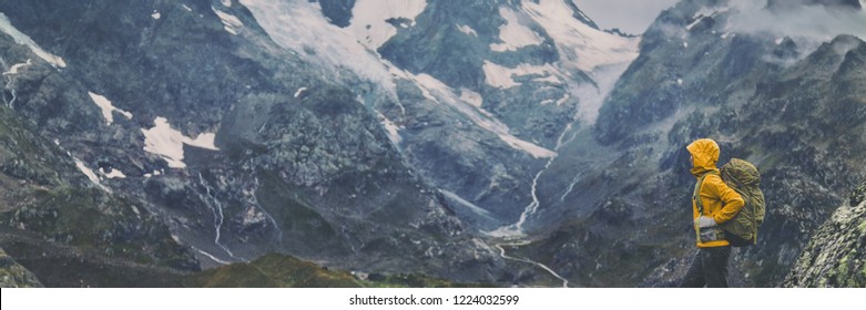 Mountain Hike Europe Travel Hiker Woman Trekking In Switzerland Alps Mountains Landscape Background. Panoramic Banner Of Hiker On Adventure Trek.