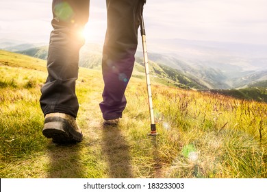 Mountain Hiking.  Lens Flare, Shallow Depth Of Field.