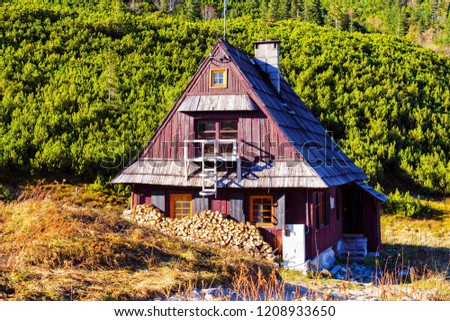 Similar – Mountain huts on green meadows in the Alps