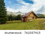 Mountain Hut. Solitary Cabin with a mountain range in the background