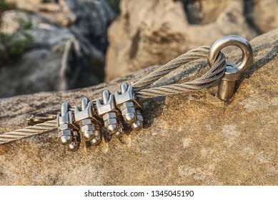 Mountain iron anchor for free climbing  Stainless cable fixed to the rock for the safety the walking route in the mountains 
