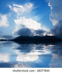 mountain lake with clouds reflection