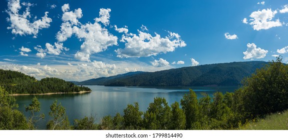 Mountain lake landscape with partly cloudy skies, Palisades Reservoir, Idaho - Shutterstock ID 1799814490