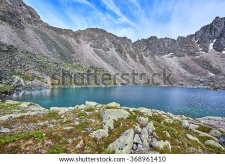 Mountain Lake at a sports pass in the Eastern Sayan . Siberia. Russia