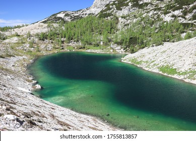 Mountain Lake With Turquoise Water In Julian Alps  On A Hiking Trail Called Seven Lakes (Sedmera Jezera), Triglav National Park, Slovenia, Europe