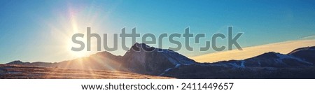 Mountain landscape with blue clear sky during sunset in autumn. Hiking The Pyrenees Mountains In Andorra Horizontal banner