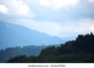 mountain landscape with clouds .