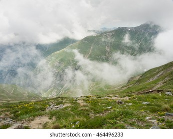 Mountain landscape with clouds and mist