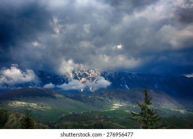 mountain landscape with dramatic rain clouds