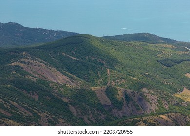 Mountain Landscape, Forested Mountains And Blue Sea, Top View.