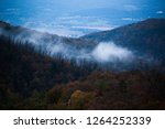 Mountain landscape with low clouods or morning fog